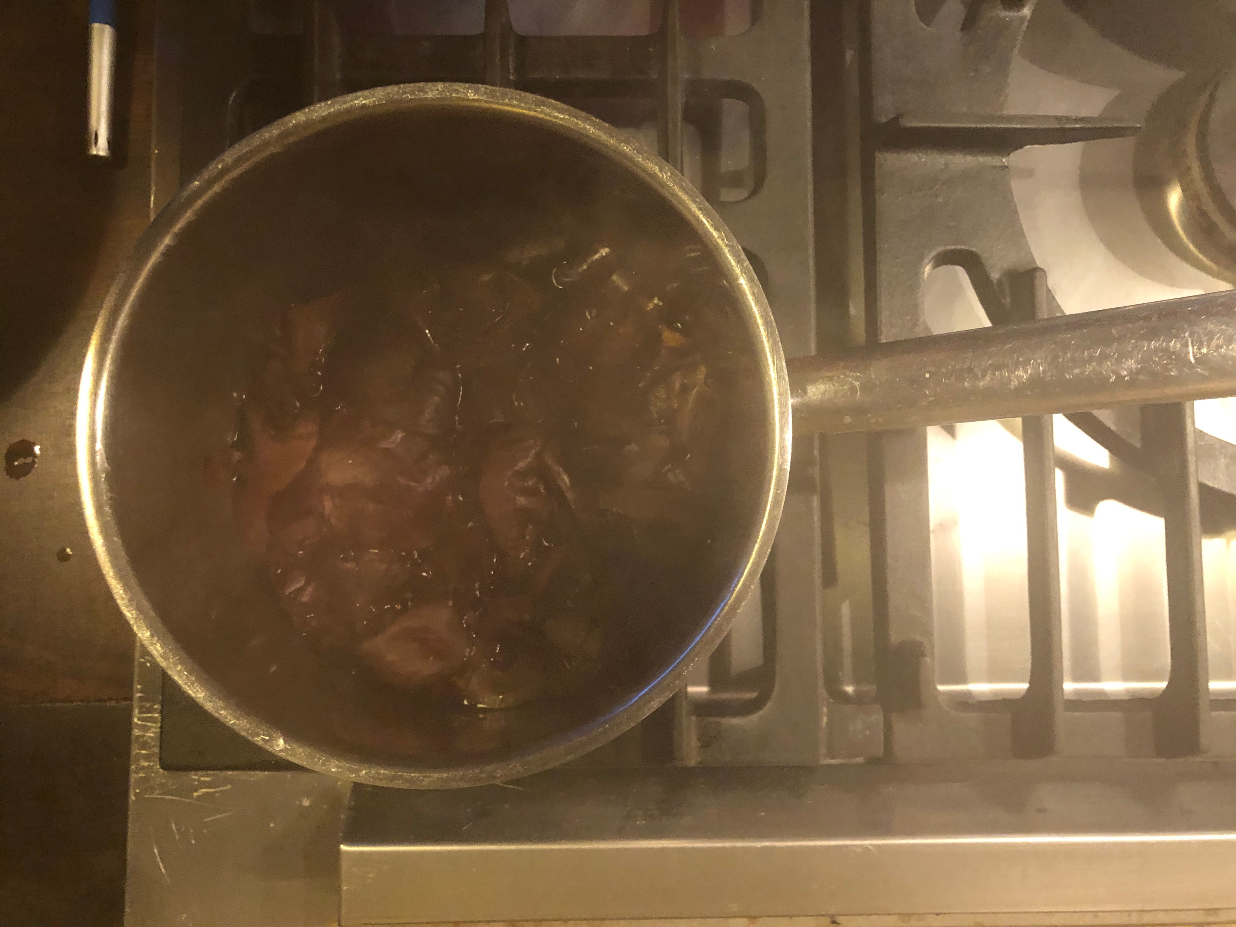 Onion skins simmering on hob